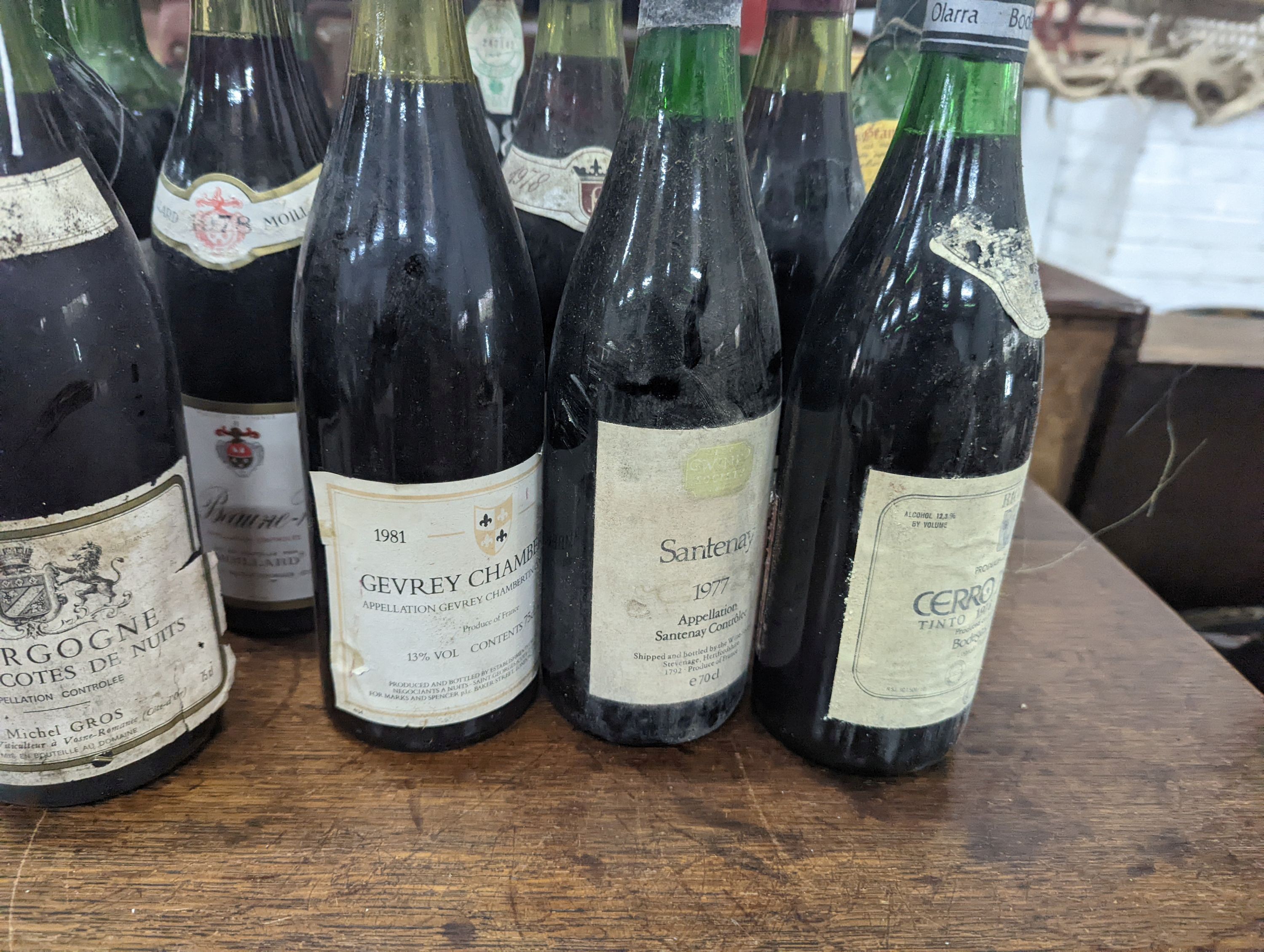 Twenty three bottles of assorted red wine, mainly French together with a bottle of Hungarian Tokaji